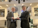 The President presents Charles Street with a fellowship certificate